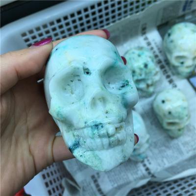 China China natural hand carved crystal skulls people open phoenix pine skulls for decoration for sale