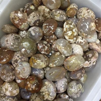 China China Natural Cherry Blossom Agate Palmstone 5-7cm Crystal Palm Tumbled Polished Stone for sale