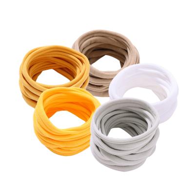 China Durable Pure Colored Simple Elastic Cloth Hair Ties Fashion Girls Multicolor Stretch New Arrival Durable Cheap Low MOQ for sale