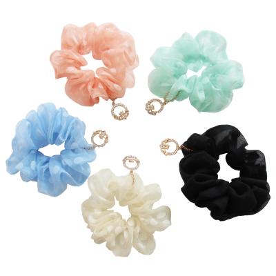 China Hot Selling Long Lasting Women Fashion Scrunchies Solid Color Large Mesh Hair Rings Elastic With Metal Rings for sale