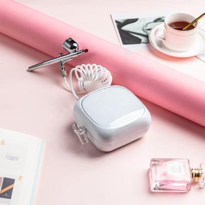 China Portable Beauty Salon+Home Mini Airbrush Compressor Makeup Paint Gun Color Bronzing Spray Booth Set Wireless Hose Airbrush Kit For Cake Decorating for sale