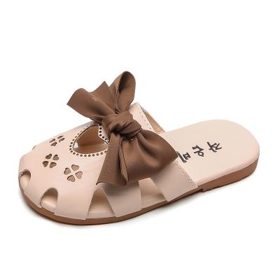 China Girls summer new children's bow-knot Baotou sandals flat slippers 2021 hollowed-out big children's baby beach shoes for sale