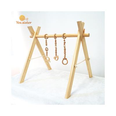 China Eco-friendly Natural Wooden Animal Pine Baby Gym With Hanging Teether Toy for sale