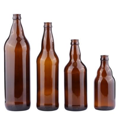 China Viable Custom Fancy Amber Clear Empty Glass Beer Bottle 330ml With Crown Cap for sale