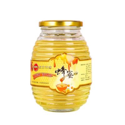 China Environmental Friendly Wholesale Hive Honeycomb Shaped Glass Honey Jar Glass Bottle For Honey Jam for sale