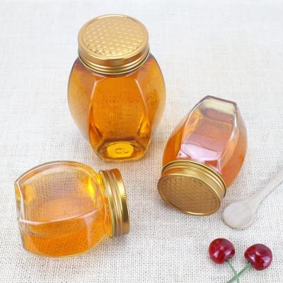 China Cute 380ml 730ml Cute Hexagonal Clear Empty Glass Honey Jars With Screw Cap for Food for sale