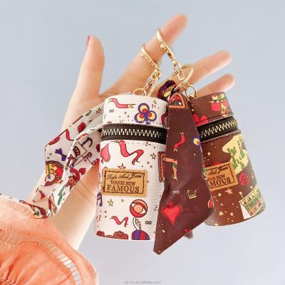 China Luxury Waterproof Creative Leather Pouch Pendant Lipstick Key Chain Purse Holder Bag Lipstick Key Chain Travel Brand Chain With Scarf for sale