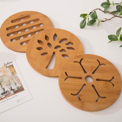 China Modern Eco-friendly Natural Bamboo Table Mat With Non-slip Foot Round Kitchen Accessory Place Mat Cartoon Heat Coaster Wooden for sale