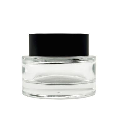 China Cosmetic Wholesale 30g Eye Cream Packaging Jar Skin Cream 50g Cosmetic Glass Jar With Black Cap for sale