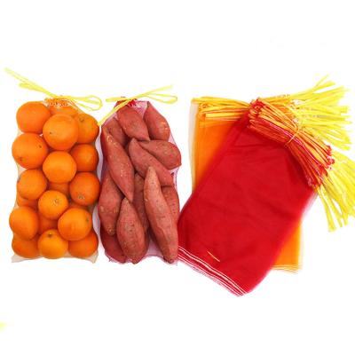 China 26*50cm reusable vegetable packing 10kg pp net bag/potato garlic fruit firewood mesh bag/orange onions bags for sale