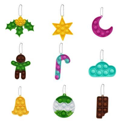 China New Popular Squeezable Silicone Kids Toys Christmas Bells Gingerbread Candy Key Chain Set Bubble Sticky Person Mini Push Keychain for sale