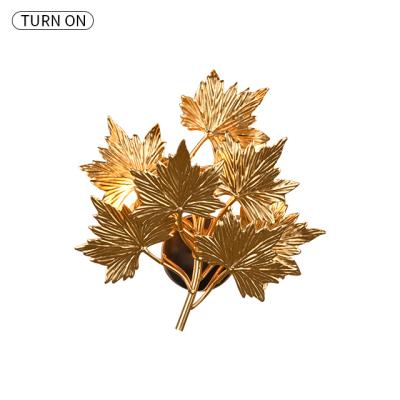 China Modern Nordic hotel lamp decoration wall lamp gold canadian maple leaf led wall lamp for villa for sale