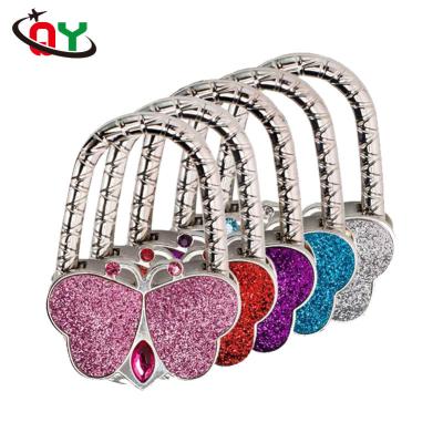 China 2019 Wholesale Cheap Metal Color Logo Bag Hanger Hook Zinc Alloy Custom Metal Bag Holder for sale