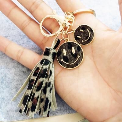 China Environmentally Friendly Wholesale Personalized Accessories Cheetah Tassel Key Chain Alloy Disc Leopard Print Tassel Key Chain for sale