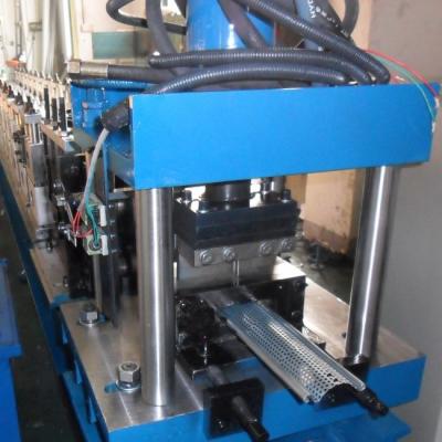 China Vertical Arch Frame Structure Shutter Door Roll Forming Machine With Punching for sale