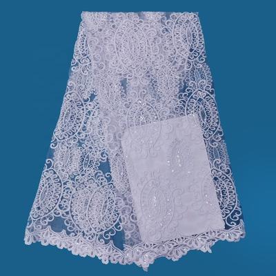 China Viable Fabric Factory New Festival Wedding Dress White Lace Pattern Fabric With Sequins for sale