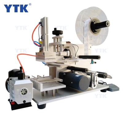 China YTK-60/YTK-60D semi-automatic food flat bottle labeling machine/box flat labeling machine for sale