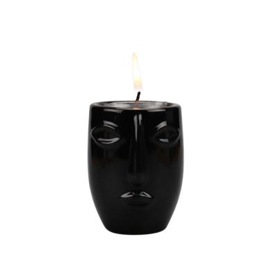 China Morden Style Minimalist Nordic Ceramic Black Design Human Face White Ceramic Candle Holder Vase for Home Decor Living Room Hotel Decoration for sale