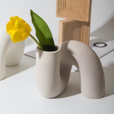 China Irregular Shaped Modern Minimalist White Flower Vases For Home Decoration Home Interior Accessories Living Room Creative Ceramic Vase for sale