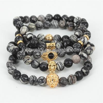 China Men's Customs Stone Hamsa Bracelet 24kt Nickel Free Natural Gold Jasper Stone Beads Skull Bracelet Black Network Bracelet for sale