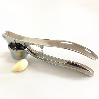 China Customized Viable Multi-Use Instruments Nut Opener Garlic Juicer Press Garlic Meat Grinder for sale