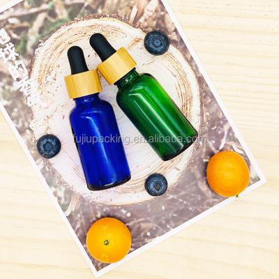 China Hot Selling Low Moq 5ml 10ml 15ml 20ml 30ml 50ml 100ml Essential Oil Low Moq Essential Oil Dropper Bamboo Glass Bottle With Bamboo Cap for sale