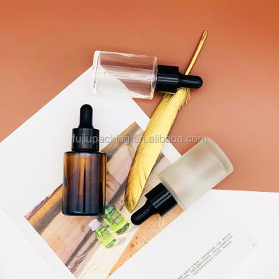 China 20ml 30ml 50ml 100ml Essential Oil Serum Flat Shoulder Frosted Clear Glass Dropper Bottle With Pipette for sale