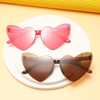 China Fashion Sunglasses Slim Peach Love Sunglasses Jelly Color Frameless Heart Shaped Candy Color Eye One Piece Lenses for sale