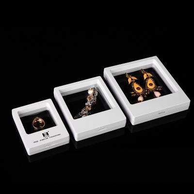 China Attractive 9*9 3d multi-color transparent magnetic floating jewelry display pe film frame case packaging plastic box for ring pendant for sale