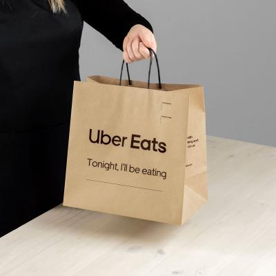 China Recycled Materials Customized 100gsm 14x10 Uber Eat Fast Food Kraft Paper Hand Labeled Brown And Black Paper Bags With Rope Handle For Shopping Grocery for sale