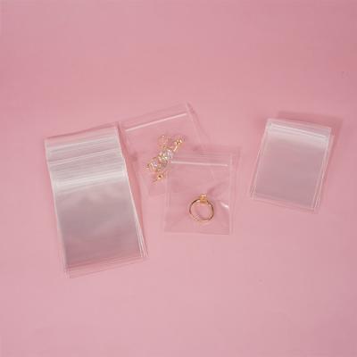 China Disposable Self-adhesive Sealing Plastic Packaging Ring Jewelry PVC Transparent Clear Zipper Bag Small For Jewelry Storage for sale