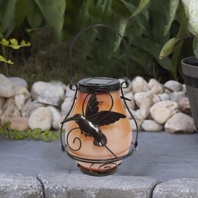 China Creative Solar Flame Lamp Garden Decoration Hanging Lantern Solar Glass Flame Solar Hummingbird Hanging Lamp for sale