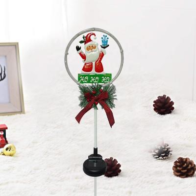 China Santa Solar Garden Stake Outdoor Holiday Metal Led Lights Stake Durable Metal Santa Christmas Solar Decoration Light for sale