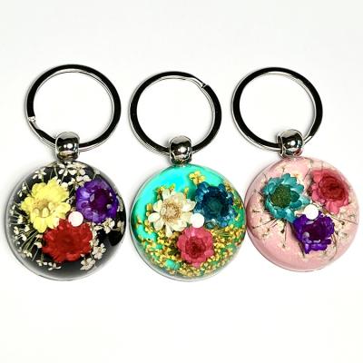 China Promotional Gift Style Small Star Flower Acrylic Resin Perpetual Key Chain Bohemian Colorful Flower Hemispherical Pendant Ornament for sale