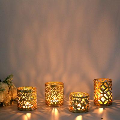 China Nordic Nordic Gold Geometric Hollow Creative Cup Candlestick Aromatherapy Iron Ornaments Household Candlestick for sale