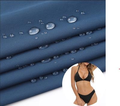 China Stretch Customized 70D+40D 90% 4 Way Stretch Fabric Nylon Semi Matte Swimwear Stretch Nylon Swimming Fabric 10% Spandex Stretch Fabric for sale