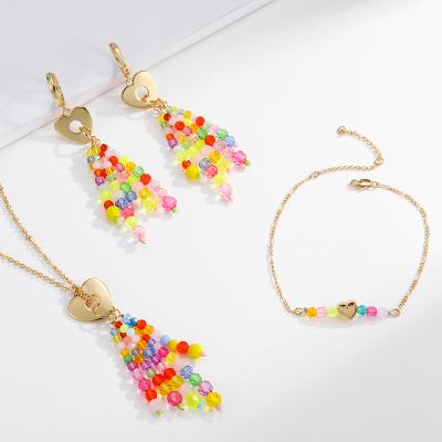 China 2022 Summer Gold Chain Colorful Beads Crystal Beads Tassel Pendant Necklace Heart Drop Earring Bracelet Jewelry Set For Women for sale