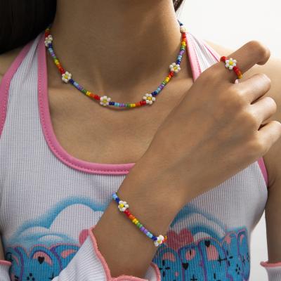 China Colorful Beaded Women's Ring Set Handmade Rainbow Beads Daisy Flower Jewelry Set For Rainbow Flower Boho Necklace Bracelet for sale