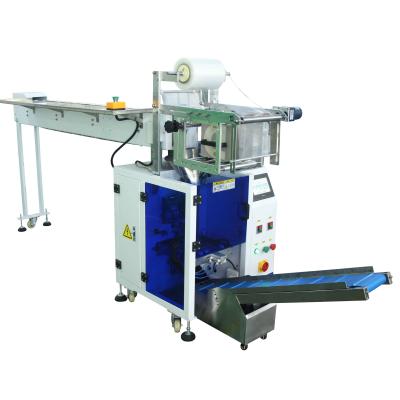 China Manual Feeding Bagging  Machine Furniture Accessories Bearing Plastic Film Packaging Machine for sale