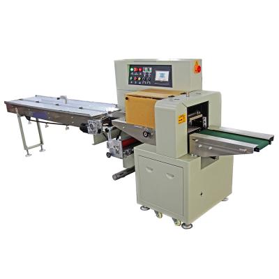 China Down-walking paper bag conveyor belt horizontal packaging machine customized mask daily necessities food film packaging for sale