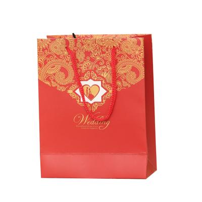 China Recyclable Custom Printed Logo Paper Bag Have Handle Rope Gift Wrapping Paper Bag for sale