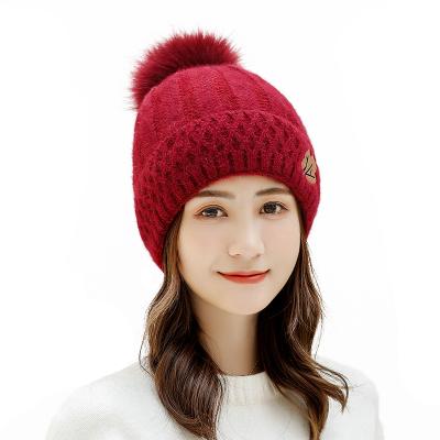 China breathable & Fashion Maple Leaf Design Autumn Womans Winter Hats Knitted Waterproof Embroidered Warm Hats for sale