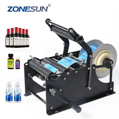 China ZONESUN ZS-50P Manual Food Mineral Water Plastic Round Bottle Labeling Machine For Round Bottles Sticker Label Packing Machine for sale