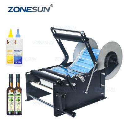 China ZONESUN ZS-50W Manual PET Glass Cosmetics Around Water Bottle Wine Plastic Tin Cans Label Applicator Labeling Machine for sale