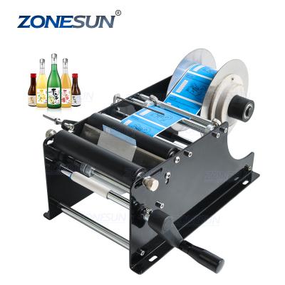 China ZONESUN Food Easy Single Manual Glue Adhesive Wet Plastic Beer Container Cans Essential Oil Bottle Labeling Machine for sale