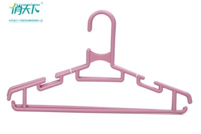 China Betterall Curved Garment Usage Plastic Material Pink Plastic Hangers for sale