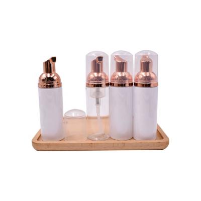 China Foam Soap Luxury Travel Size Empty Refillable Cosmetic 50ml Plastic Rose Gold Foam Pump Bottle For Facial Cleanser for sale