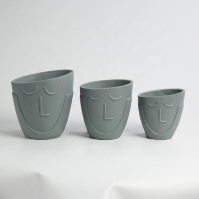 China Gray Small Cement Face Planters Succulent Pot Pastoral Cartoon Flower Pot Figure for sale