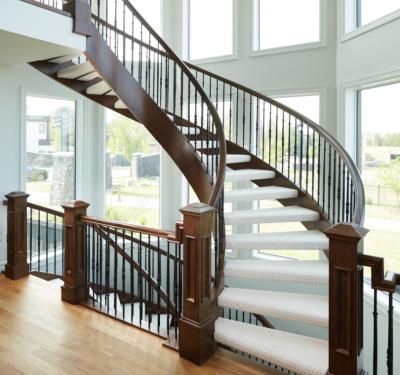 China Contemporary Customized Wrought Iron Balustrade Design Luxury Wooden Curved Stairs For Villa for sale