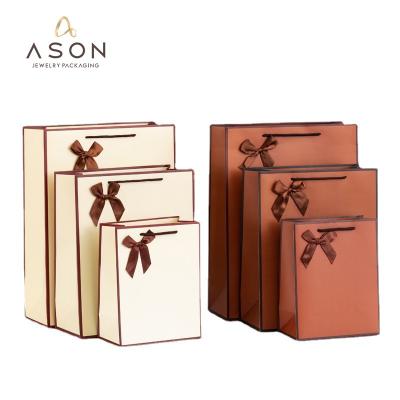 China Korean Simple Stain Paper Bag Bow Version Jewelry Packaging Gift Bag Wholesale for sale